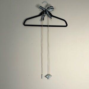 Leather cord necklace with white tassels NWT